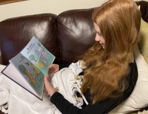 Claire reads 'S' is for Stock Market